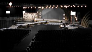 Glue-3d-rendered-animation-live-your-dream-lyd-stage-above-audience-seating-view